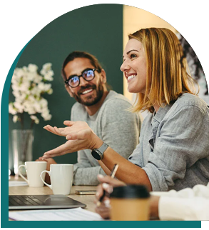 Picture of two smiling people at a table.